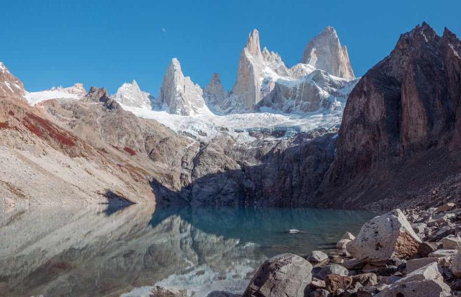 The grey glacial waters of Laguna Torre with ice fragments near the shore