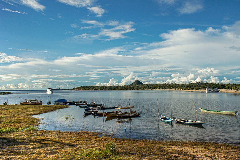 Riverboat crossing the Tapajós River at sunset near Alter do Chão