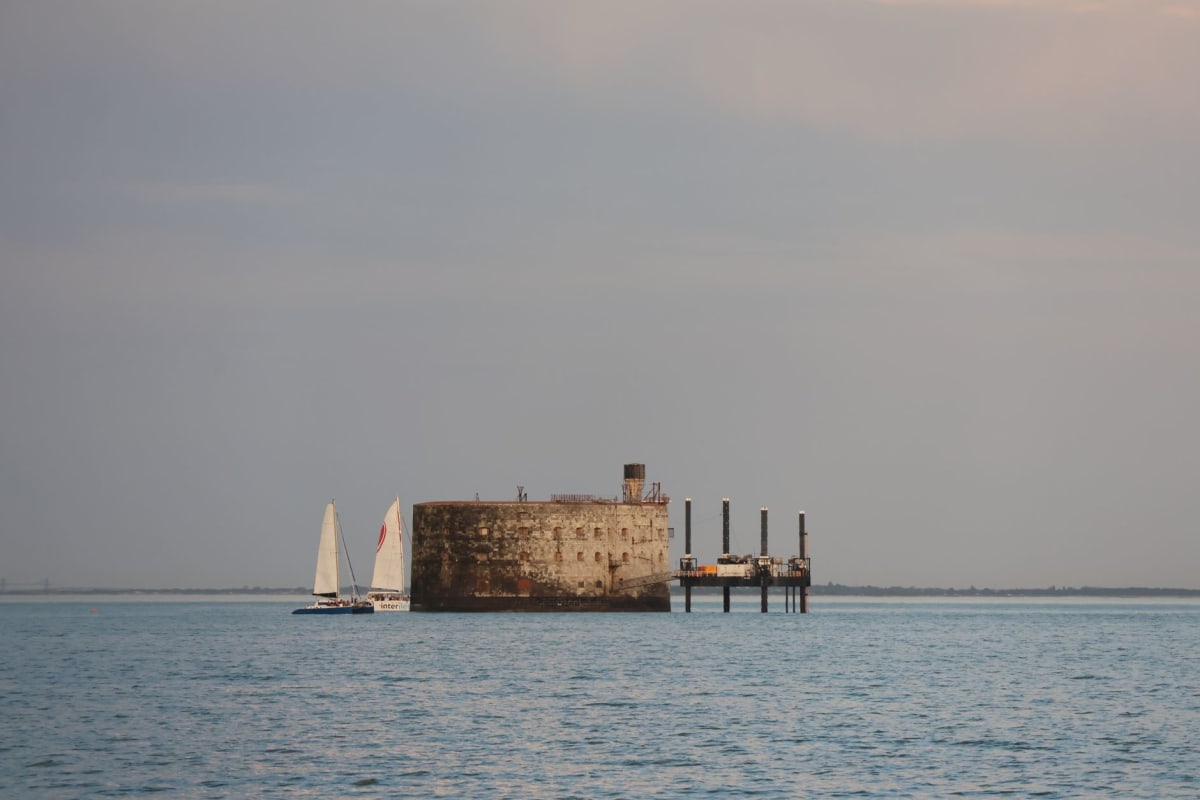 The hexagonal brick walls of Fort Jefferson rising from shallow turquoise water in the Dry Tortugas, viewed from the ferry approach