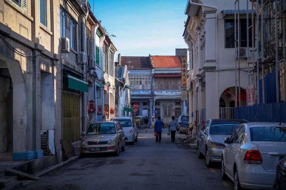 Arcaded shophouse colonnades along Zhongshan Road in Xiamen's old town at evening