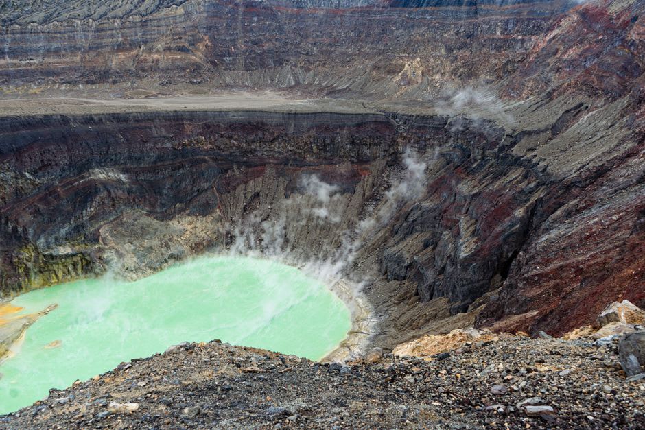 Wide view into the black lava floor of the Sierra Negra caldera from the crater rim