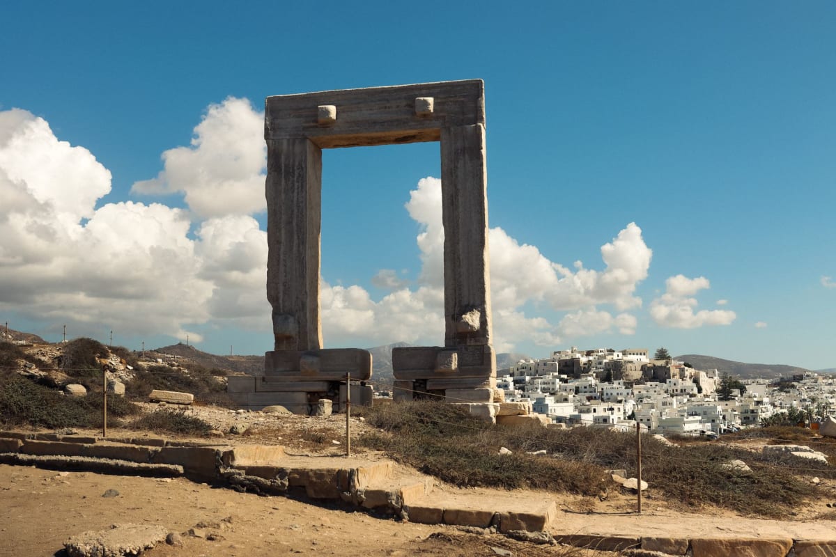 The Portara marble gateway on Naxos at sunset with the sea behind