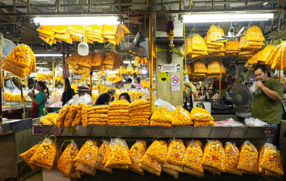 Marigold garlands and prasad offerings for sale near Hanuman Garhi temple