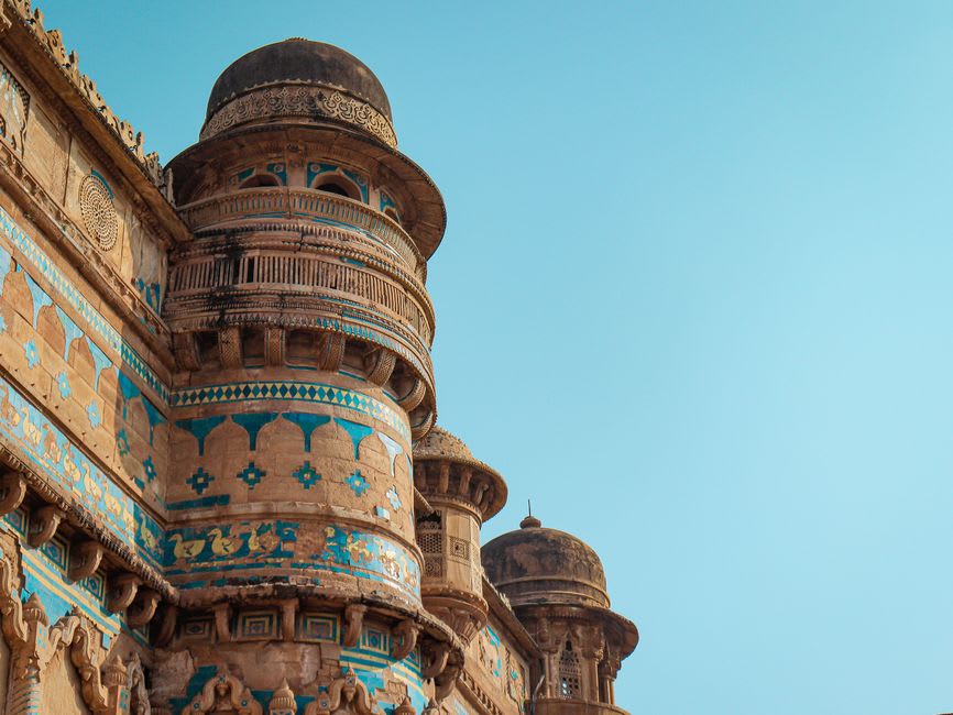 The turquoise and yellow glazed tilework on the exterior of Man Singh Palace at Gwalior Fort