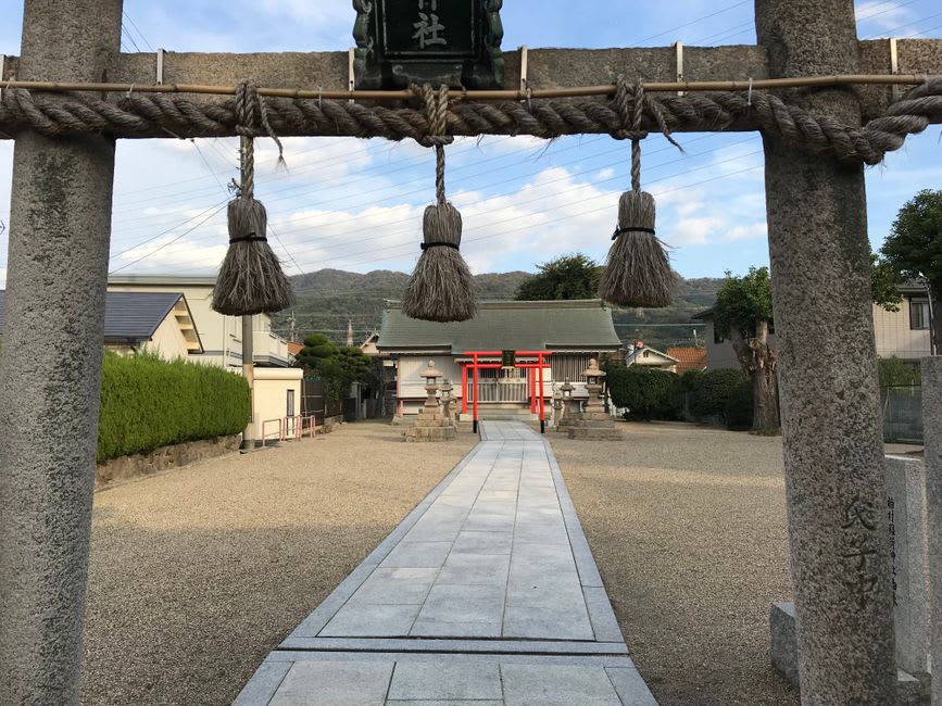 Weathered wooden shrine buildings on Iwaishima where the Kanmai sacred dance is traditionally performed