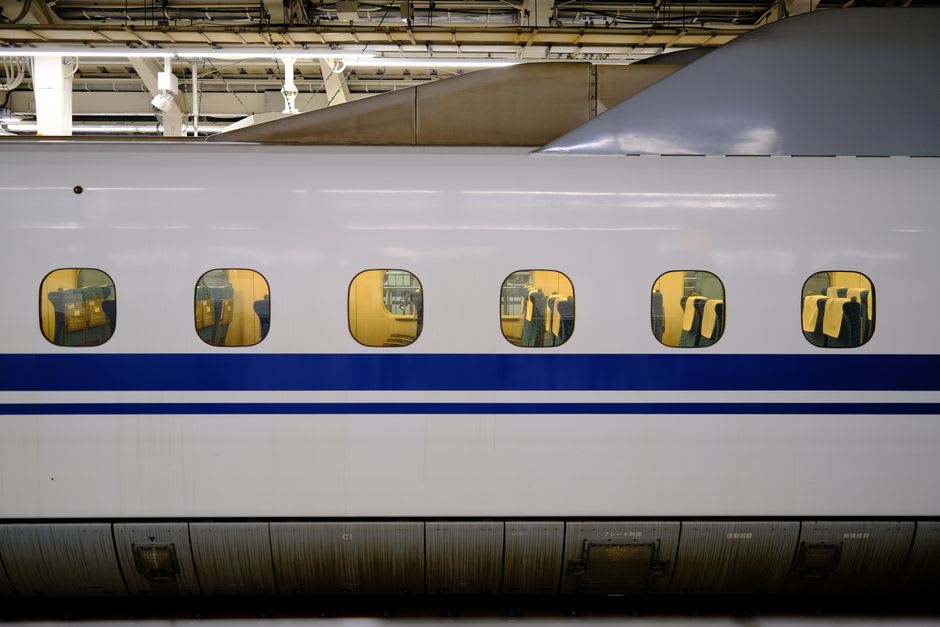 The small Shinkansen station at Kikonai, Hokkaidō, with the surrounding fishing town visible beyond the platform