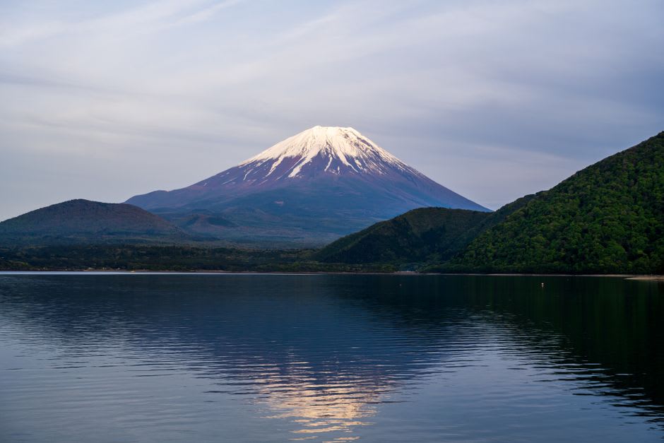 The chain-climb route on the bare rock face of Mount Ishizuchi wreathed in cloud
