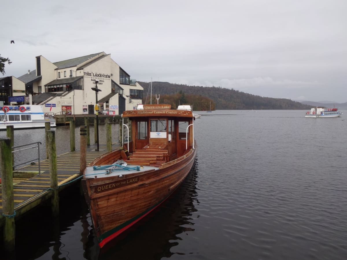 The Ullswater Steamer arriving at Glenridding pier, passengers disembarking against a backdrop of fells