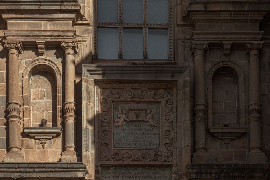 The carved Plateresque portal of Ex-Convento de San Agustín Acolman, intricate stone reliefs framing the main entrance
