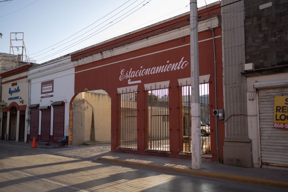 Wrought-iron balconies and tiled facades along a quiet street in the Zona Rosa, Matamoros