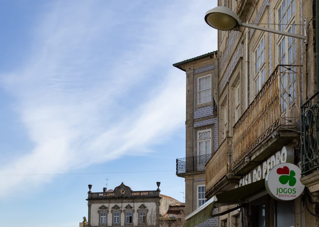 The vast weekly Feira de Barcelos market with rows of pottery, produce, and livestock stalls filling the square