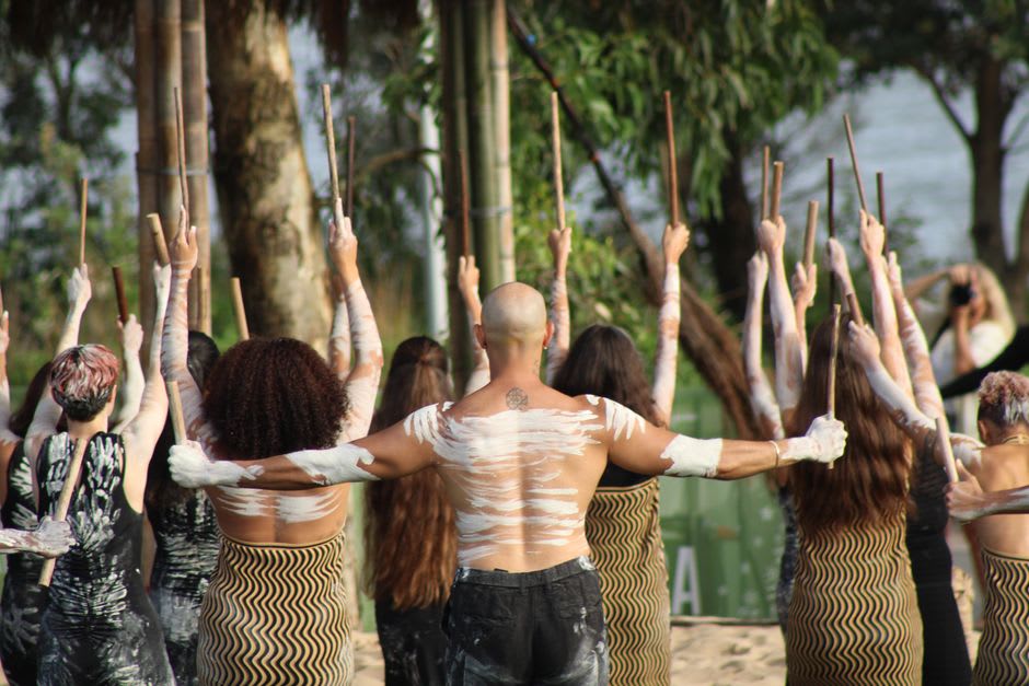 Pauliteiros stick dancers performing in traditional black and red costume in Miranda do Douro's main square