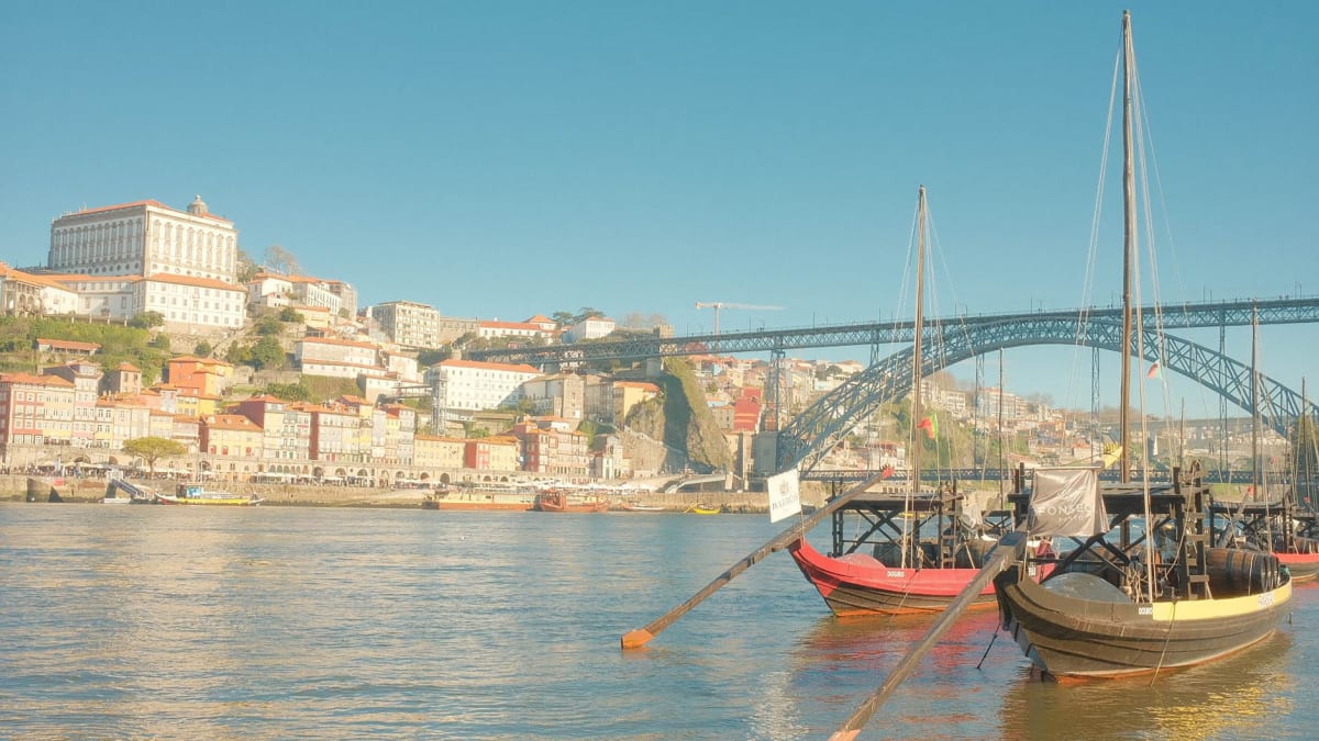 The double-deck iron arch of the Dom Luís I bridge spanning the Douro gorge with Vila Nova de Gaia wine lodges behind