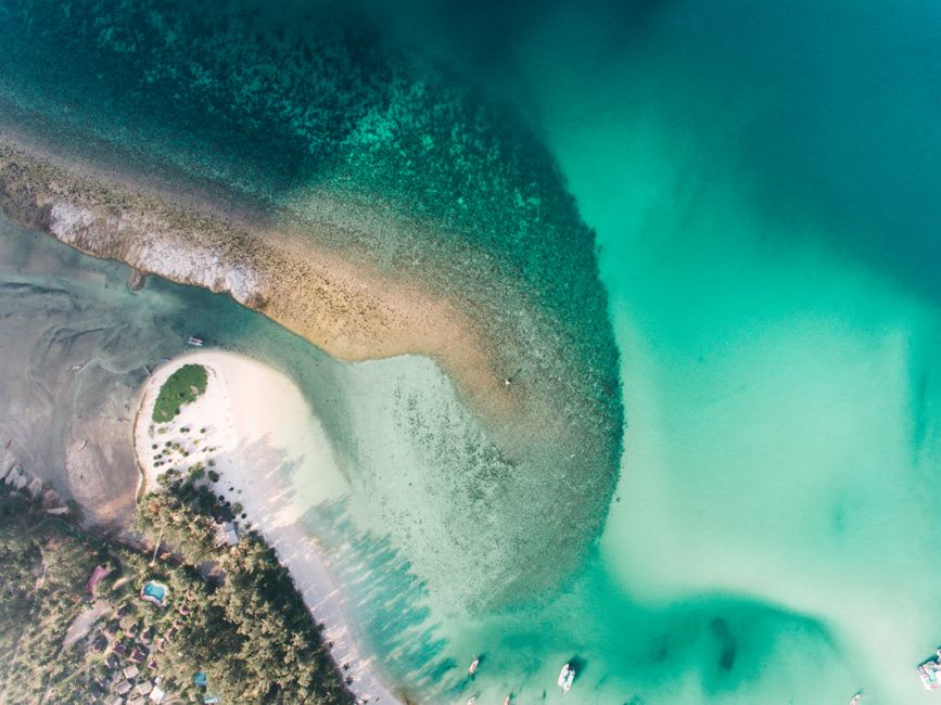 Golden sandbar beach and calm turquoise lagoon waters near Vila Nova de Cacela at low tide