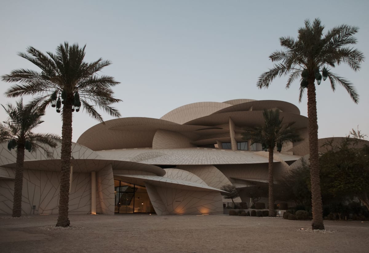 A gallery at Mathaf showing Arab abstract expressionist works from the 1950s and 1960s, the paintings large and color-saturated against white walls
