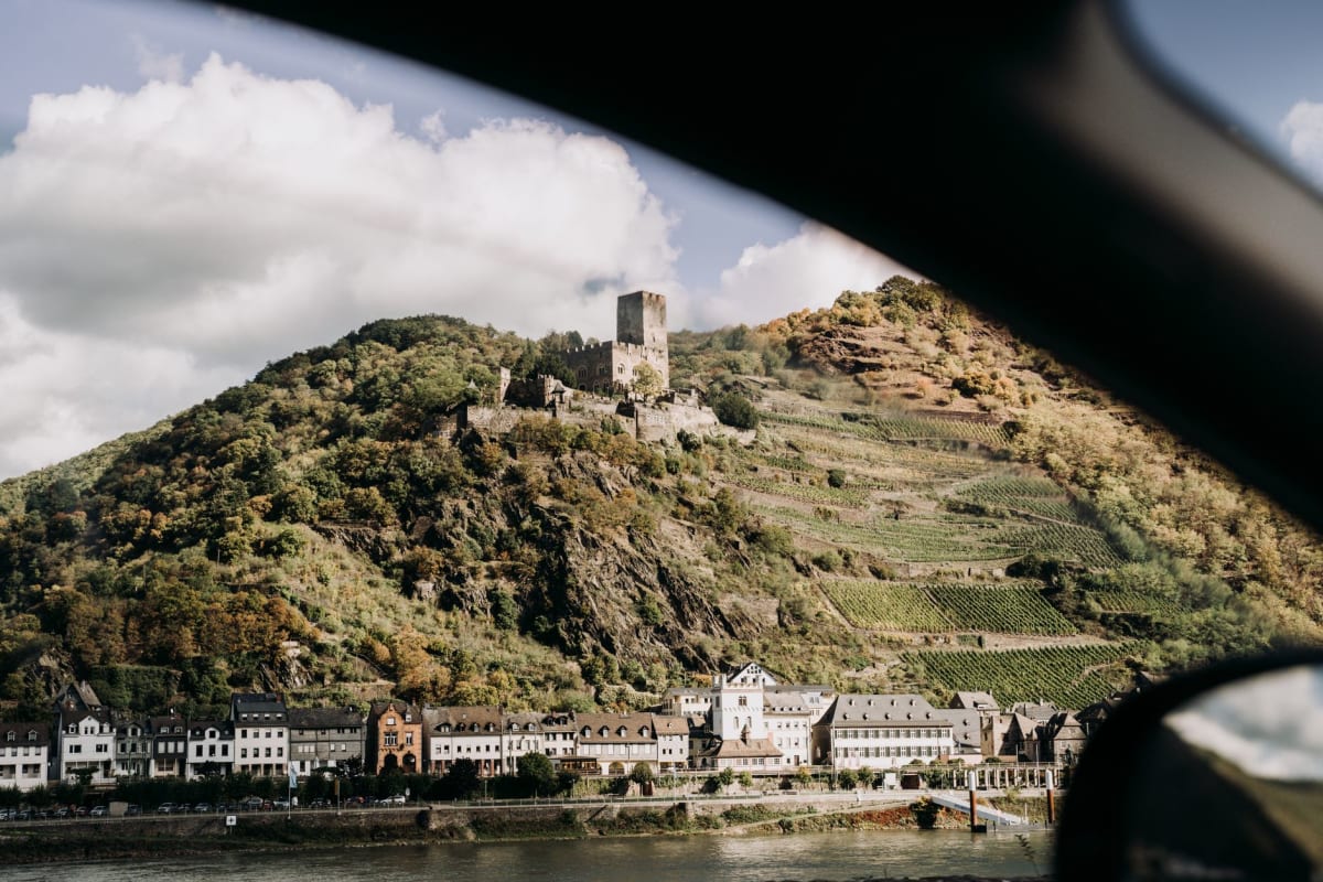 The roofless Gothic ruin of Werner Chapel at dusk in Bacharach's old town center