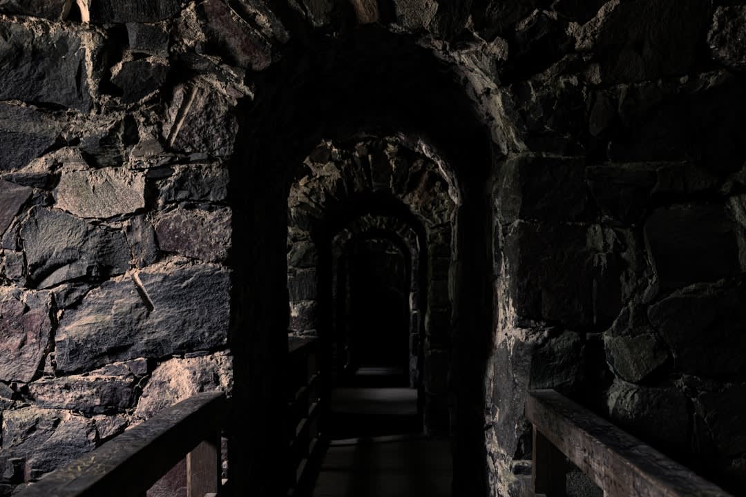 Weathered stone archway leading into the ruined casemates of Rheinfels Castle