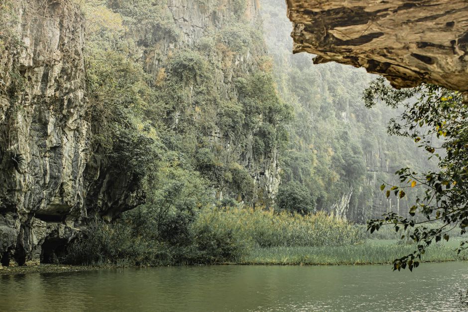 Steep forested limestone cliffs rising above the Dunajec River gorge