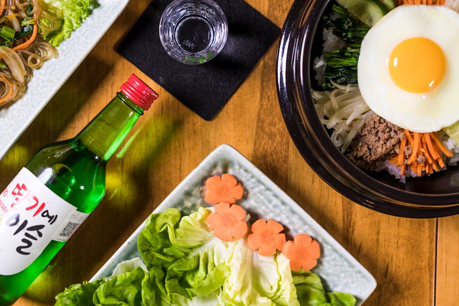 A colourful Korean bibimbap bowl with fresh vegetables and egg