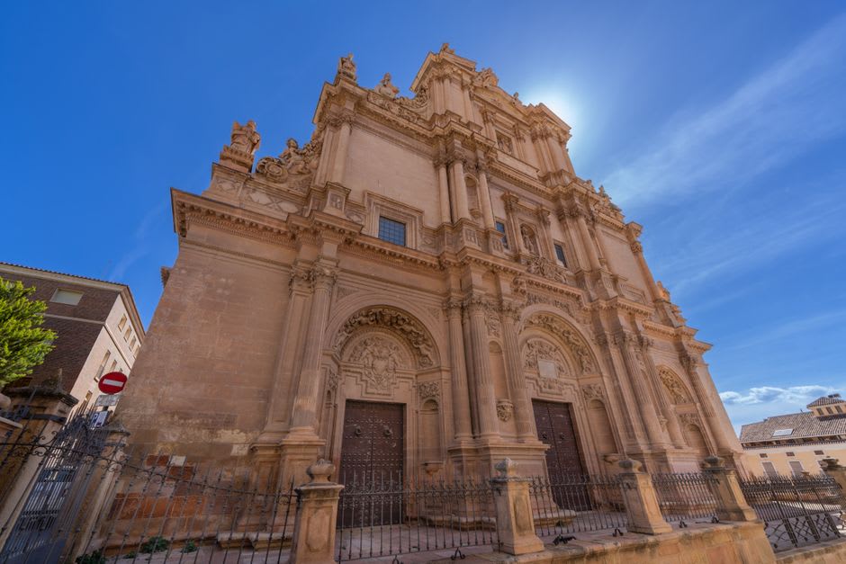The ornate baroque facade of the Colegiata de San Patricio in Lorca's Plaza de España