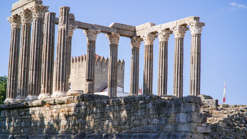 Ancient Roman columns of the 2nd-century temple standing beside Vic's medieval cathedral