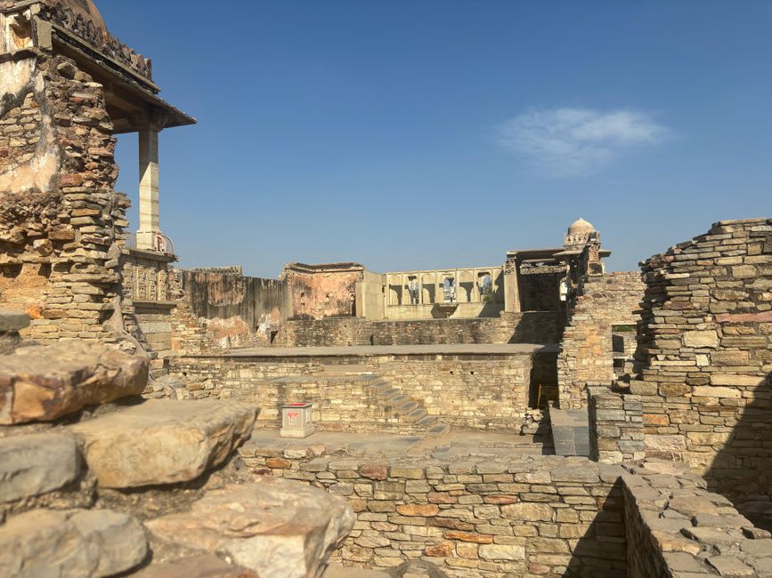 Ruined stone walls of the old Chand-era fort overlooking the terraced Pithoragarh valley below