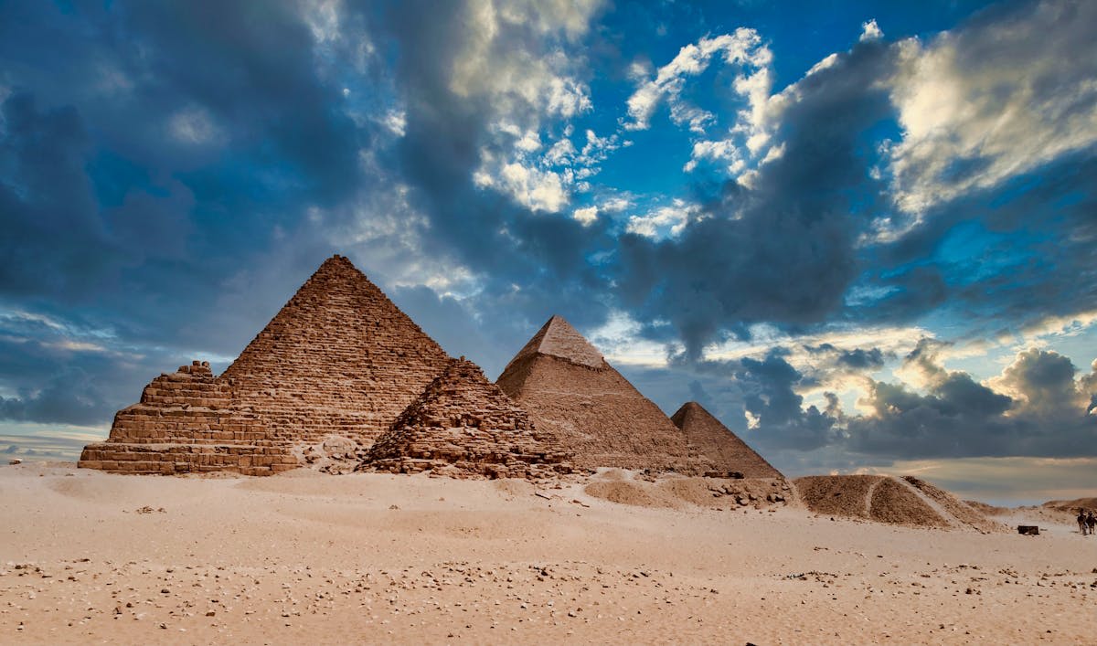 The Great Pyramids of Giza glowing at sunset