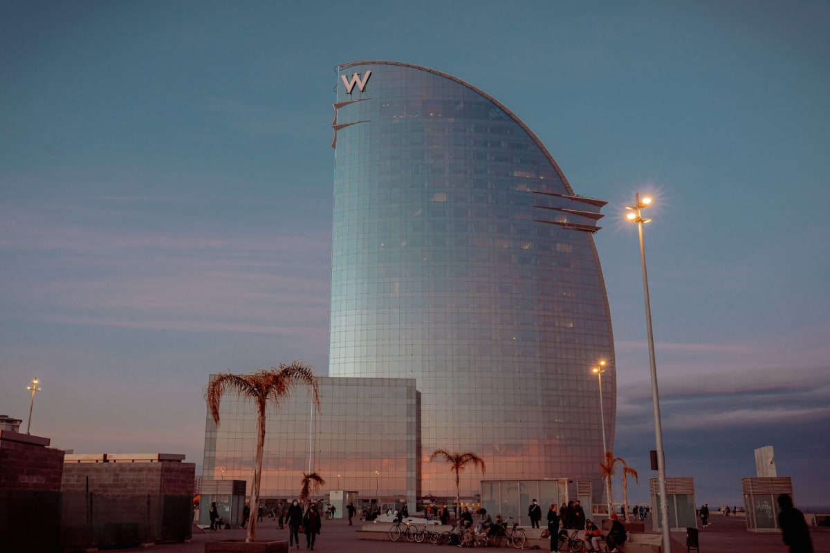 A warm Barcelona terrace with evening light and vermouth glasses