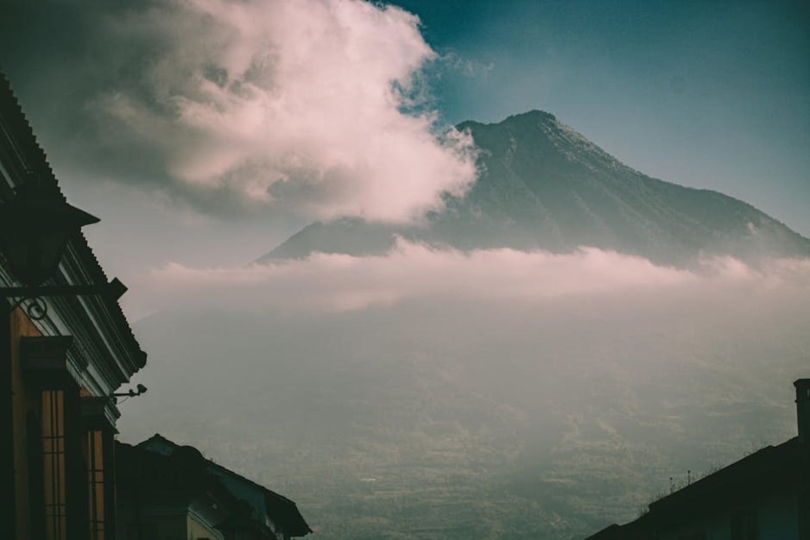 Guatemala travel guide layout with volcanic highlands and Lake Atitlán photography
