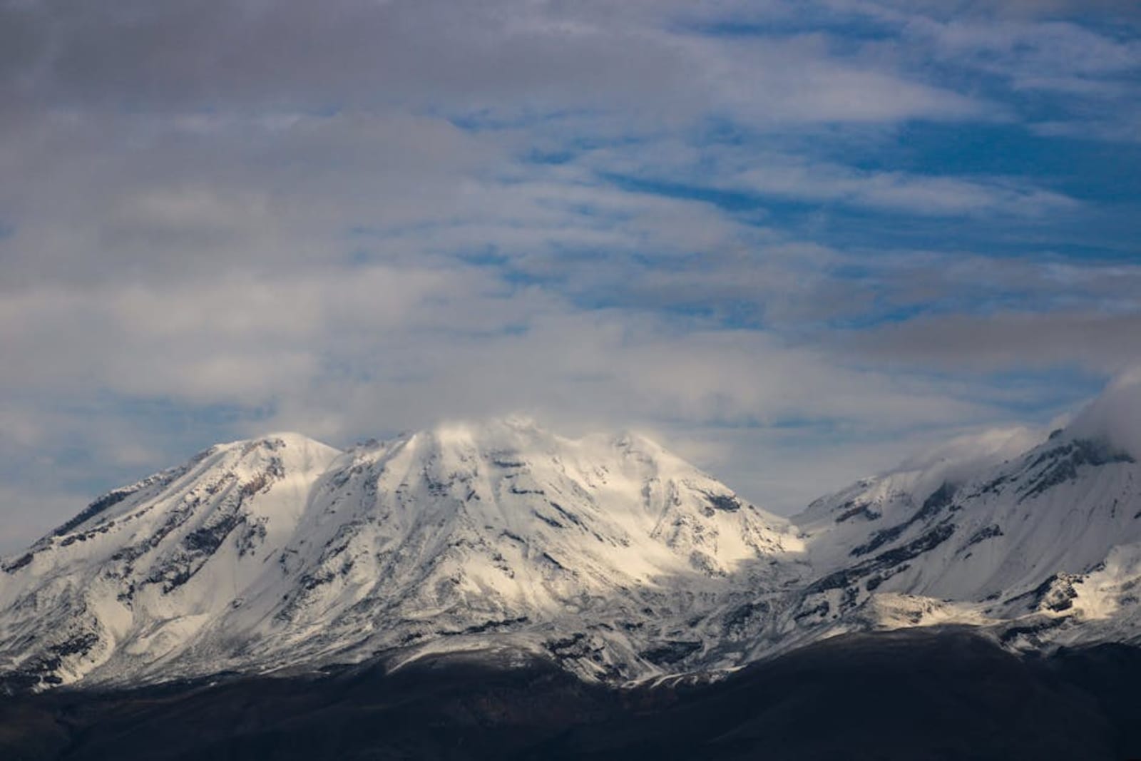 Andean mountain peaks rising above green valleys in Peru