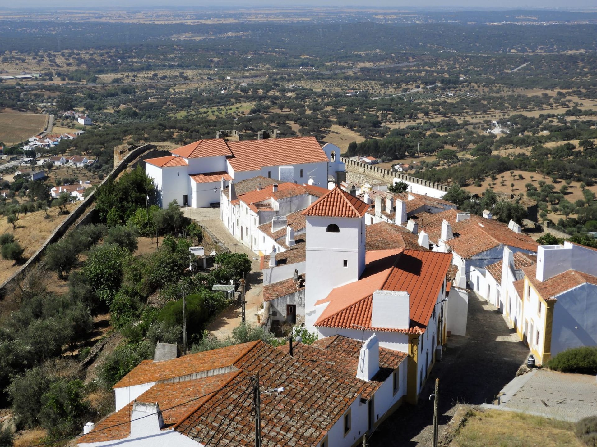 The hilltop village of Evoramonte rising above the Alentejo plains with its medieval castle and whitewashed houses