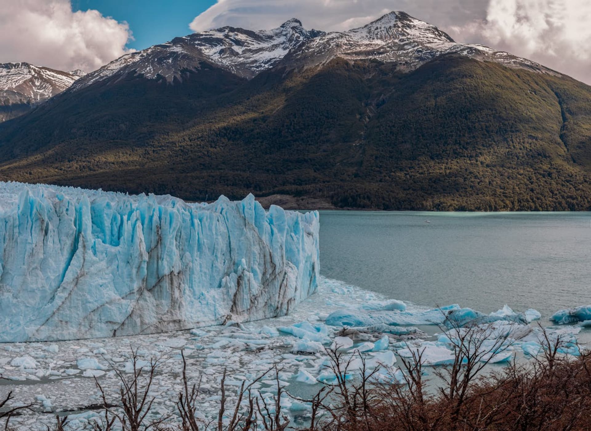 Dramatic Patagonian landscape with jagged mountain peaks and a glacial lake