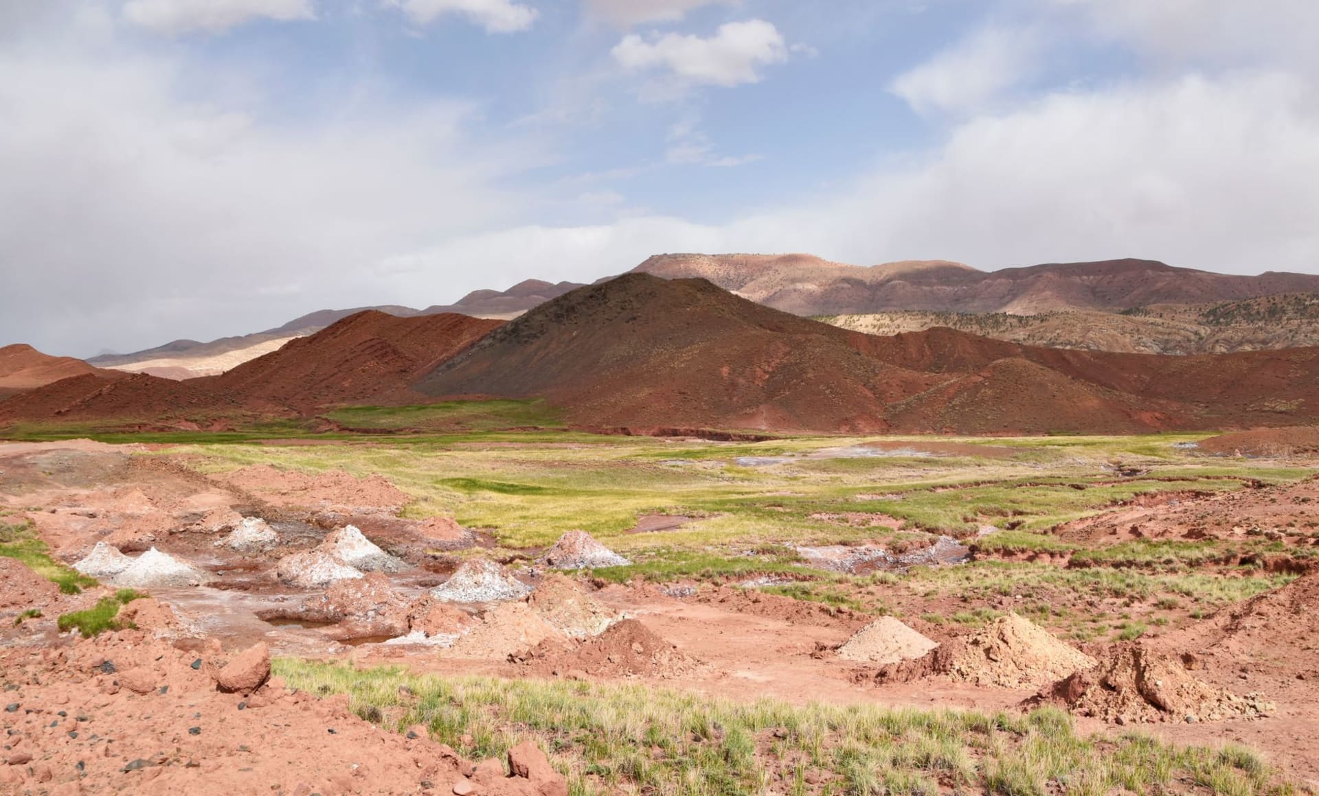 The half-ruined earthen kasbah of Telouet rising from the bare High Atlas hillside under a clear blue sky