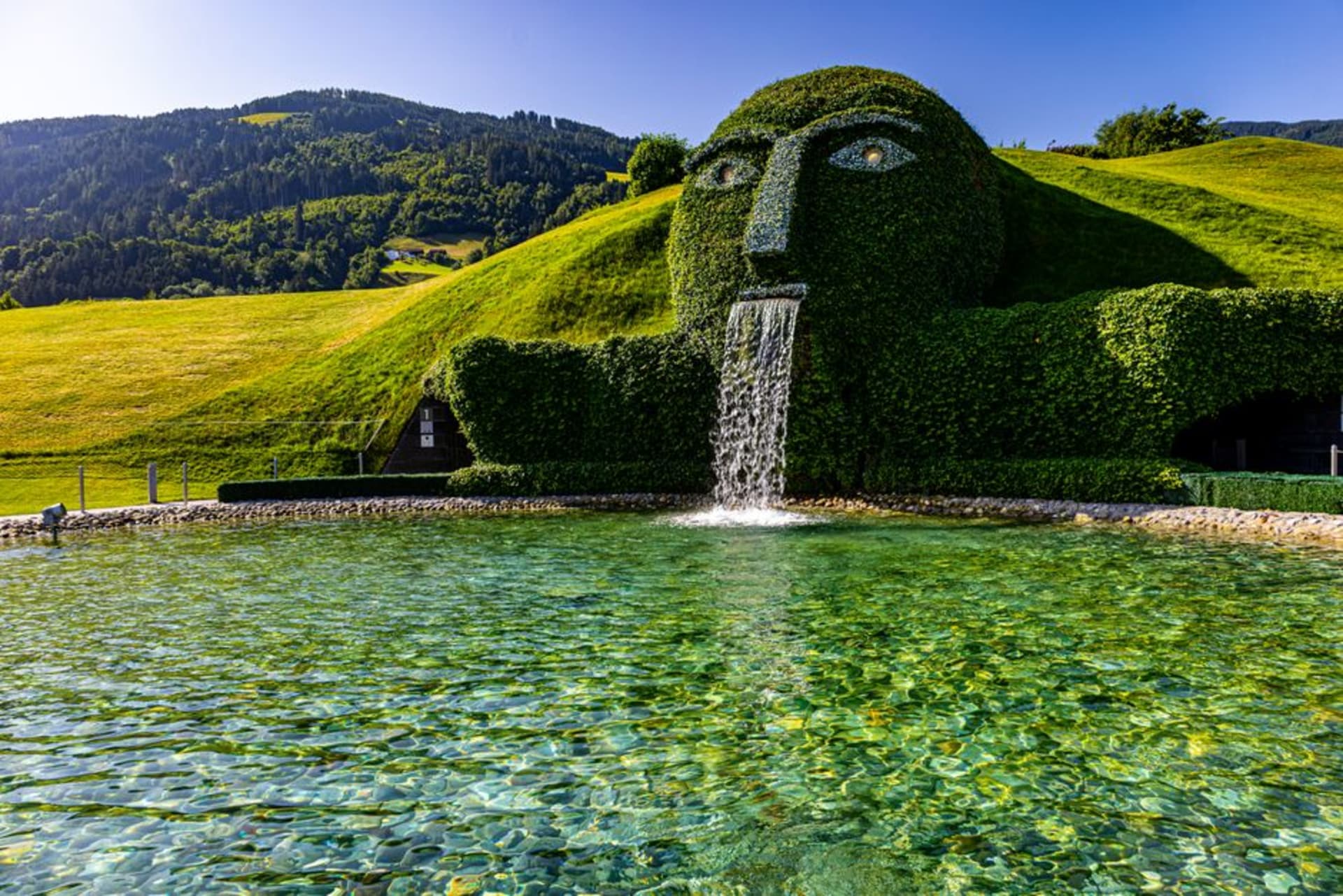The giant grass-covered head fountain at the entrance to Swarovski Kristallwelten in Wattens, Austria