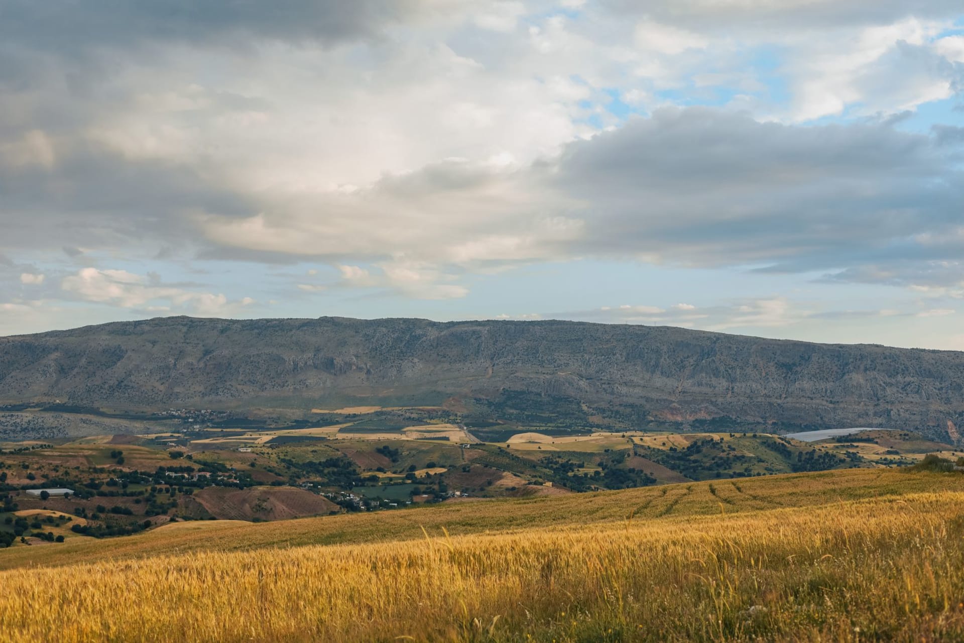 The ancient Roman pyramid monument of Hermel rising from a rocky hillside above the northern Bekaa Valley