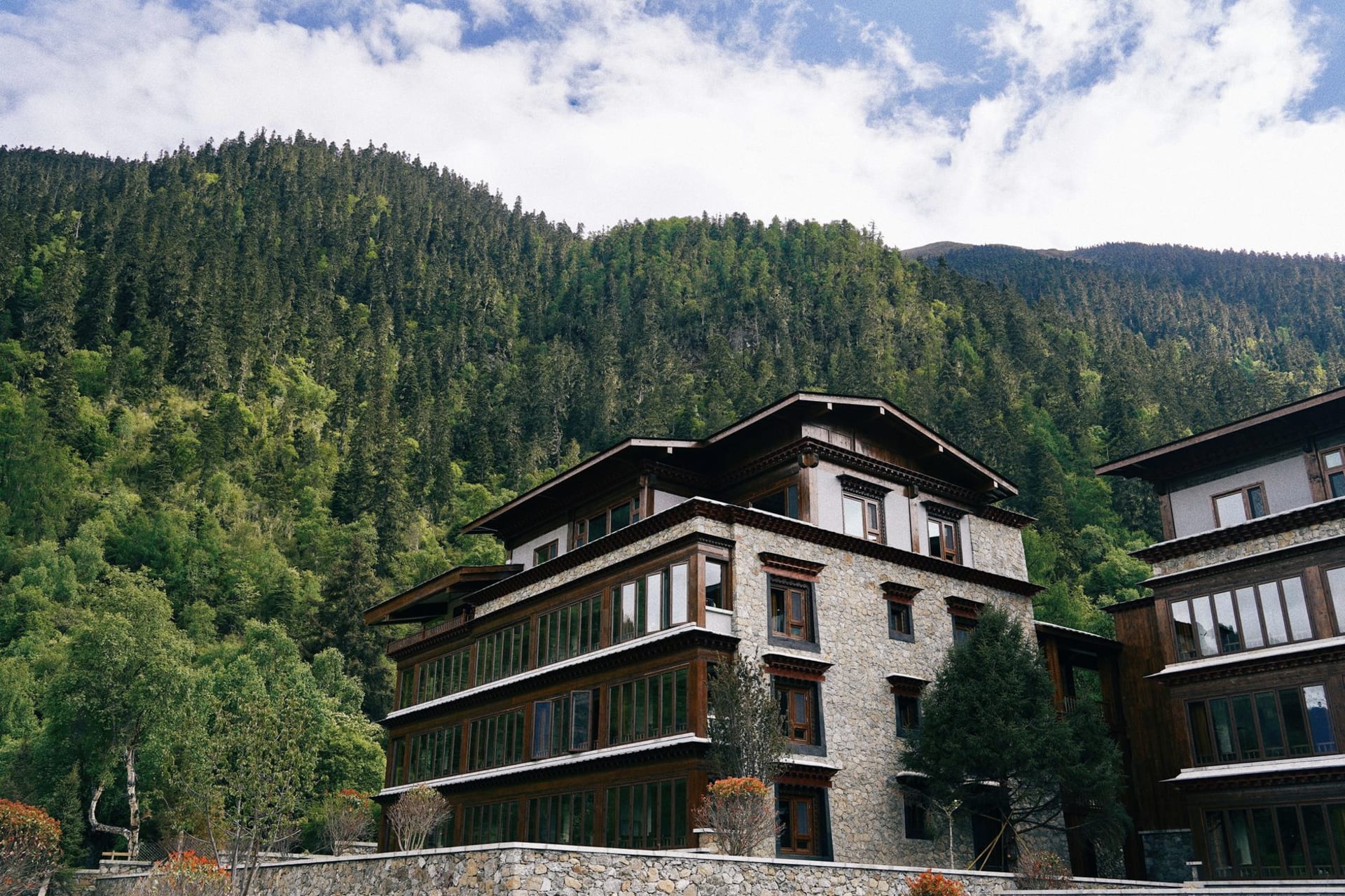 Jakar Dzong rising above the Choekhor valley in Bumthang with buckwheat fields and pine forests