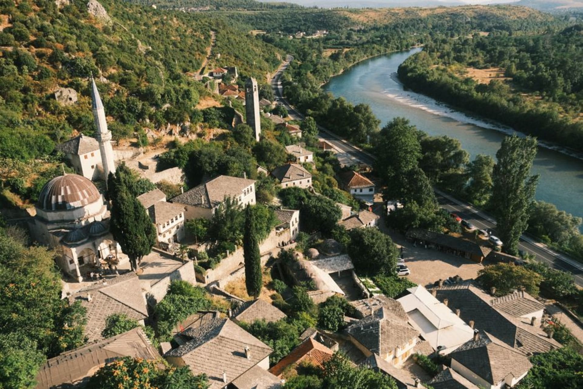 Stone houses of Stolac's old town rising along the banks of the Bregava River