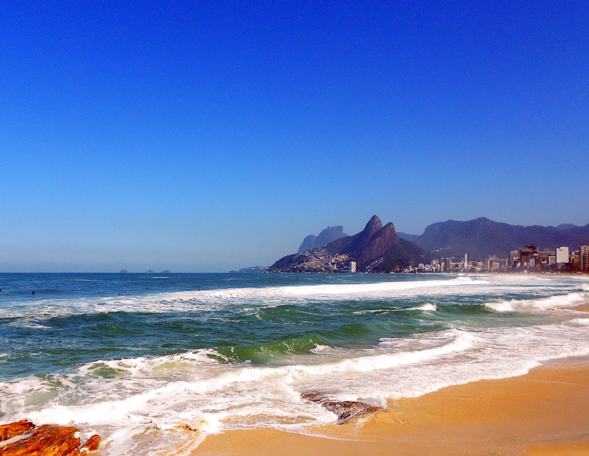 Ipanema beach at sunset with the twin peaks of Dois Irmãos in the background