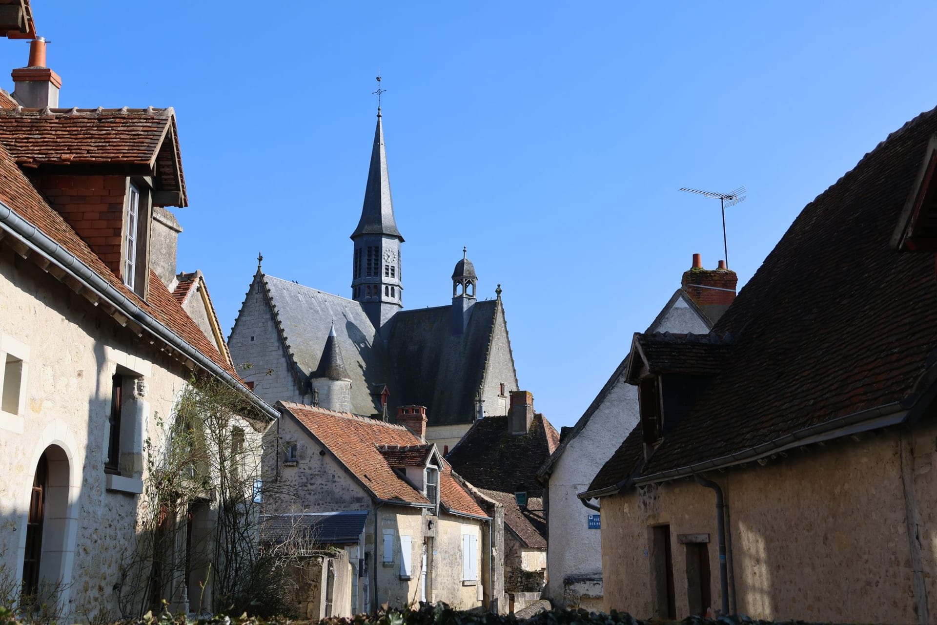 The multicolored glazed tile roof of the Hôtel-Dieu in Beaune glittering under October afternoon light
