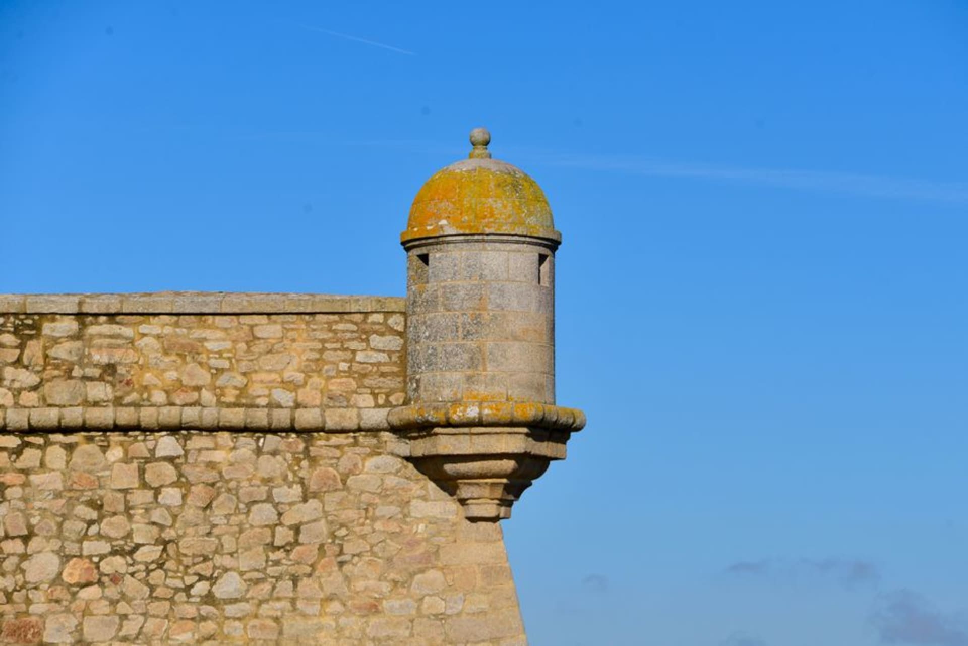 The turreted stone silhouette of Château de Bazoches rising above the green Morvan hills