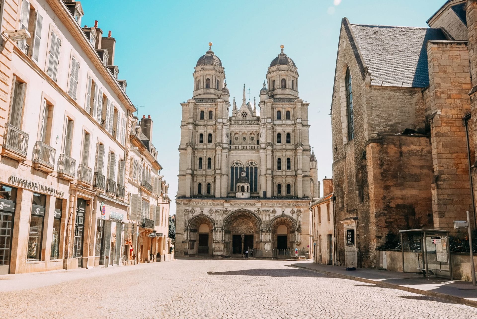 The Basilica of Sainte-Marie-Madeleine in Vézelay seen from below, its towers rising above the medieval village on the hilltop