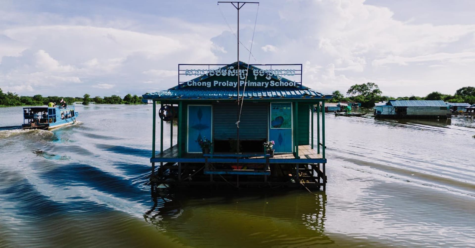 Floating village with colourful houses on stilts on Tonle Sap lake