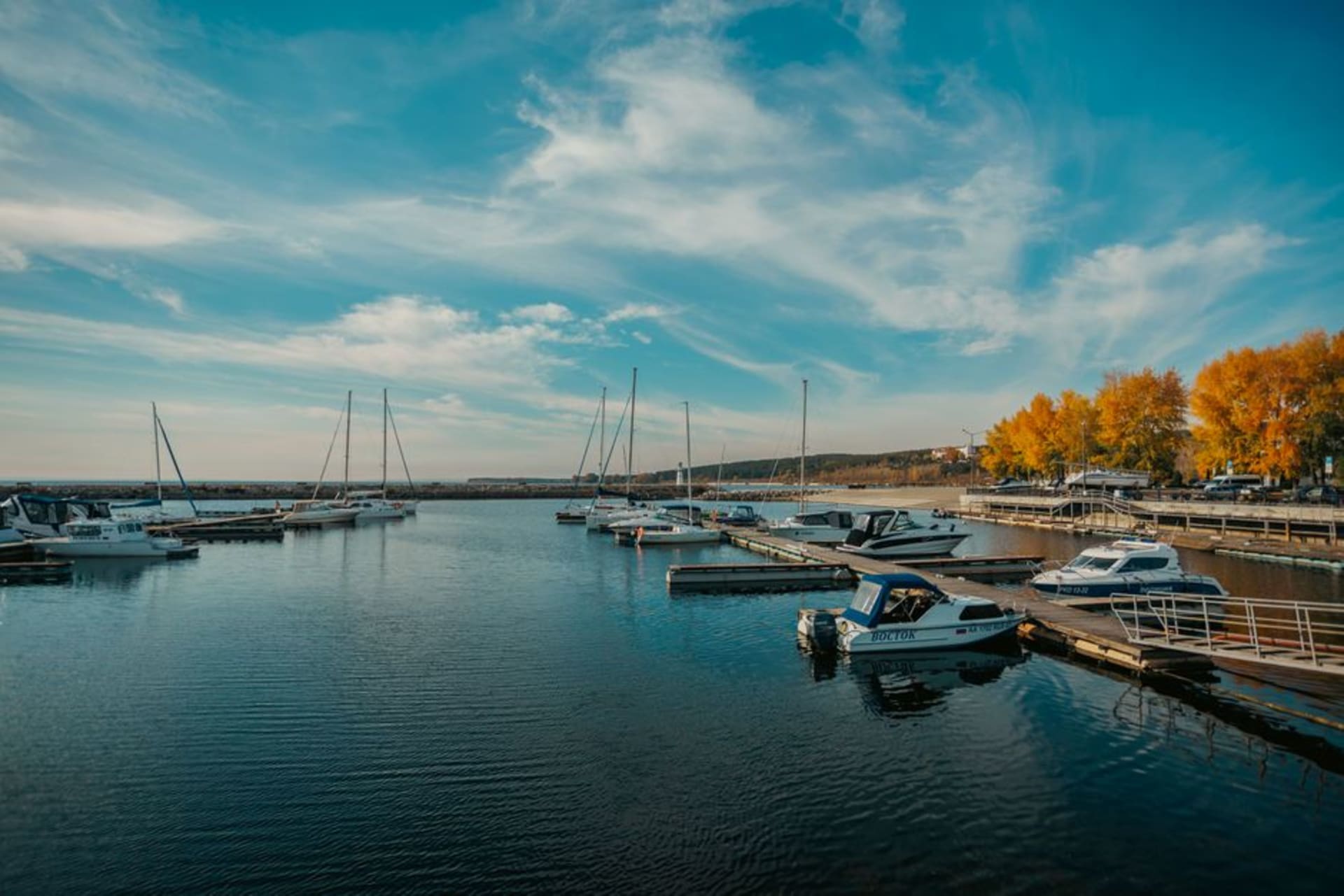 Sandy beach and marina at Gimli on the shore of Lake Winnipeg with a Viking longship statue nearby