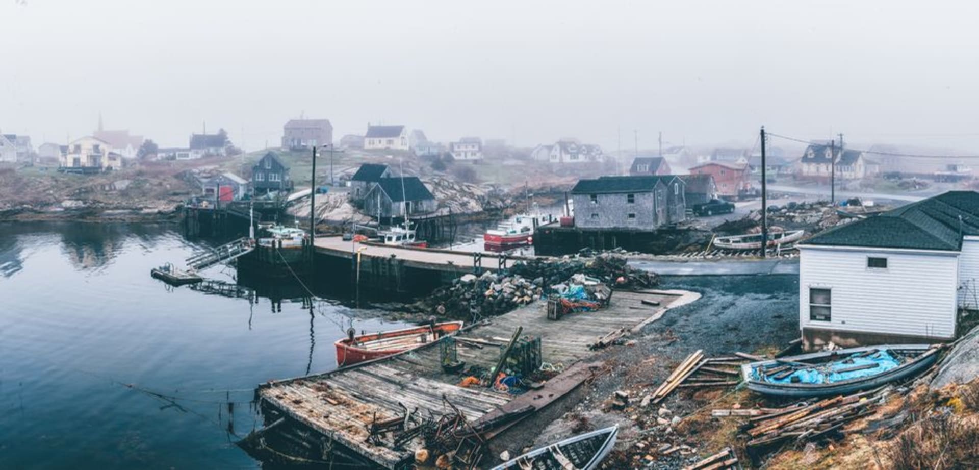 Fishing boats moored in a fog-shrouded harbour on Grand Manan Island