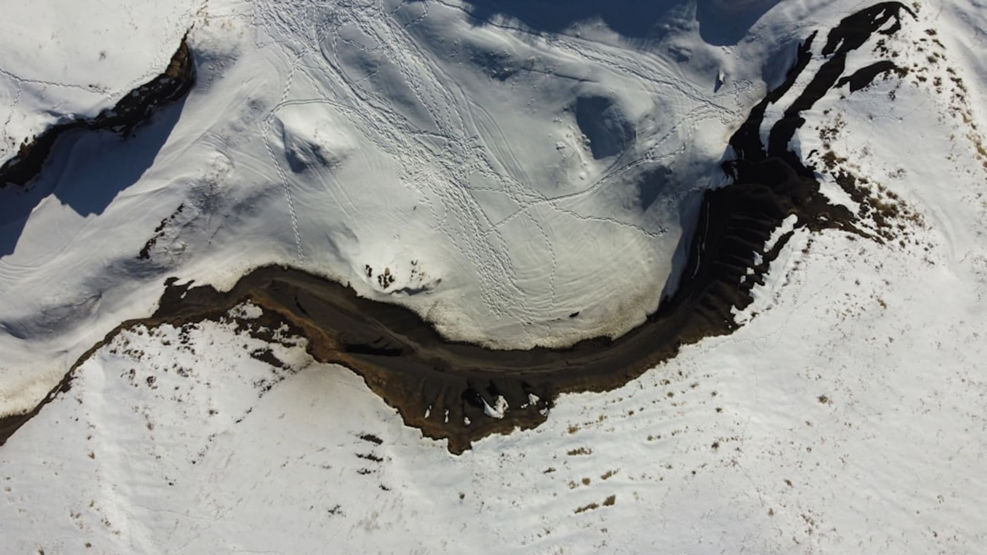 Mount Logan's massive snow-covered massif rising above the Kluane Icefield under clear sky