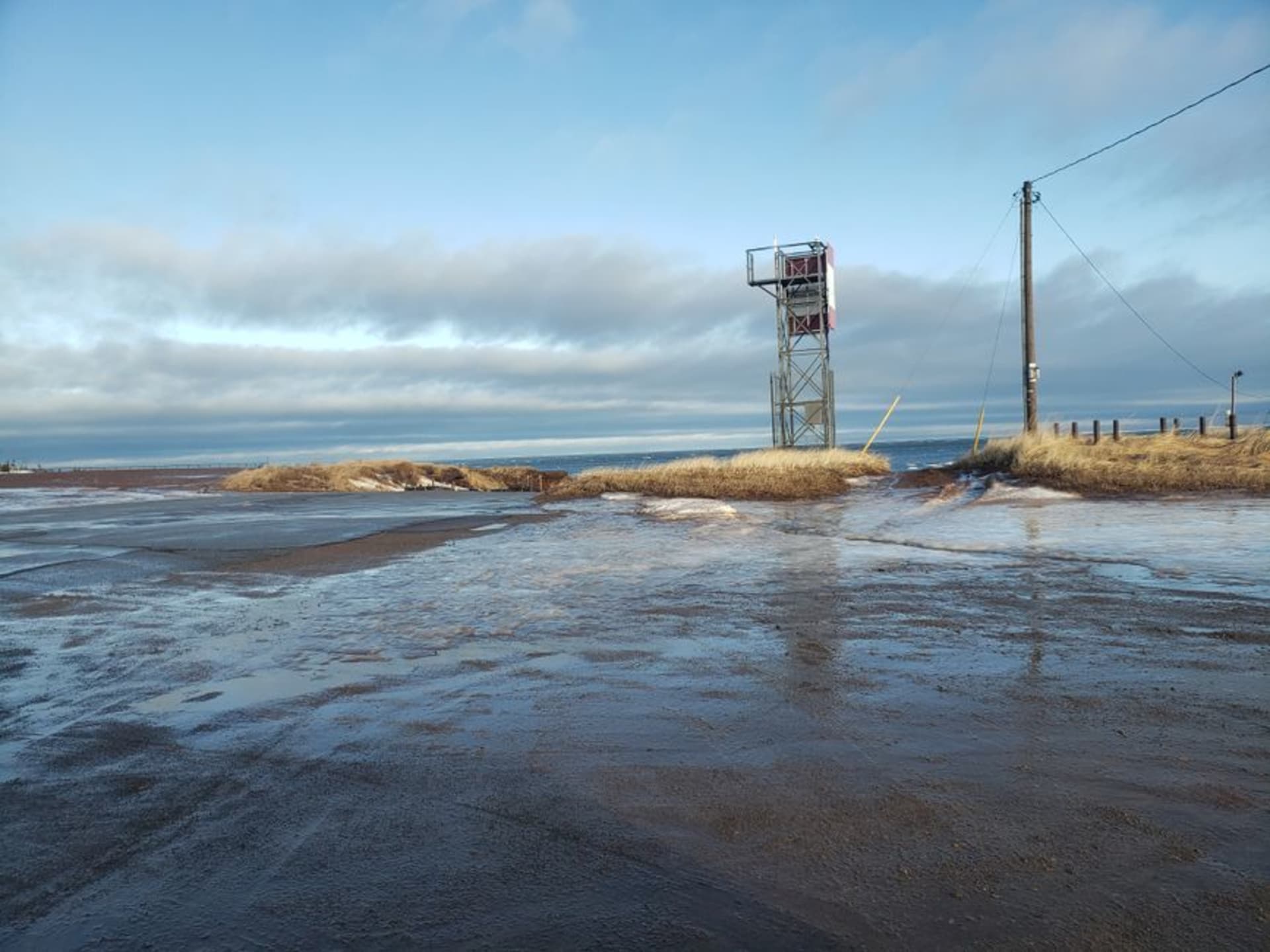 Warm turquoise lagoon waters behind a barrier island beach at Kouchibouguac National Park