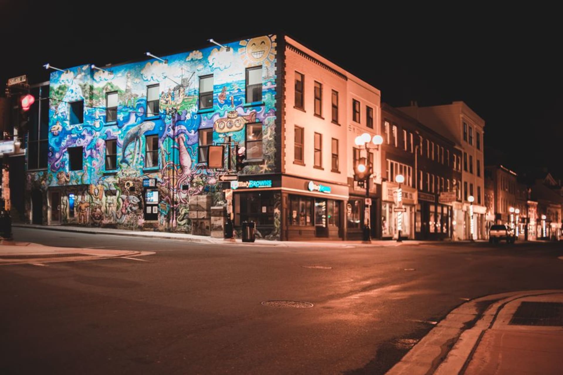 Colourful historic mural covering the side of a downtown Moose Jaw building