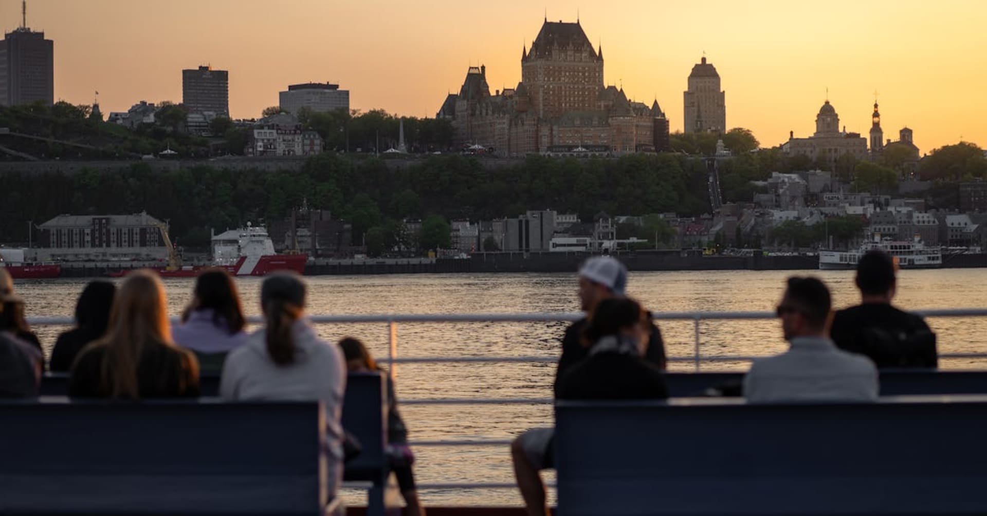 Chateau Frontenac towering above the old city walls at twilight