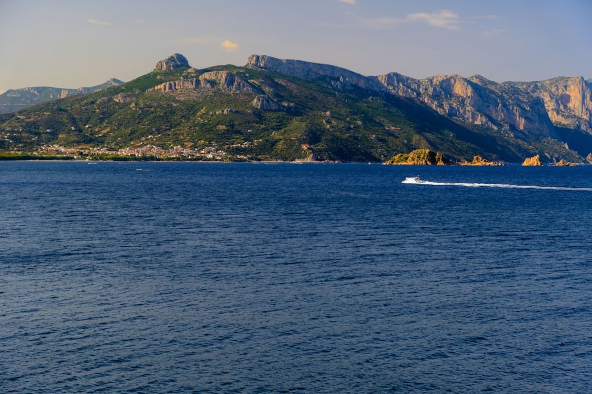 Ferry crossing the waters of Howe Sound with forested coastal mountains behind