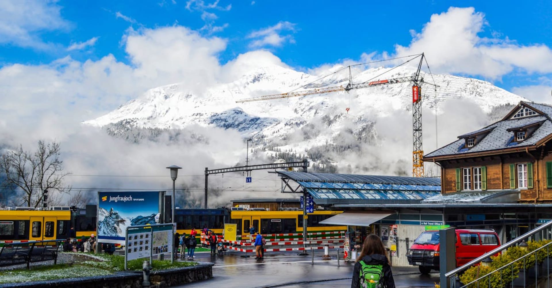 Snow-covered peaks above Whistler Village with ski runs cutting through the forest